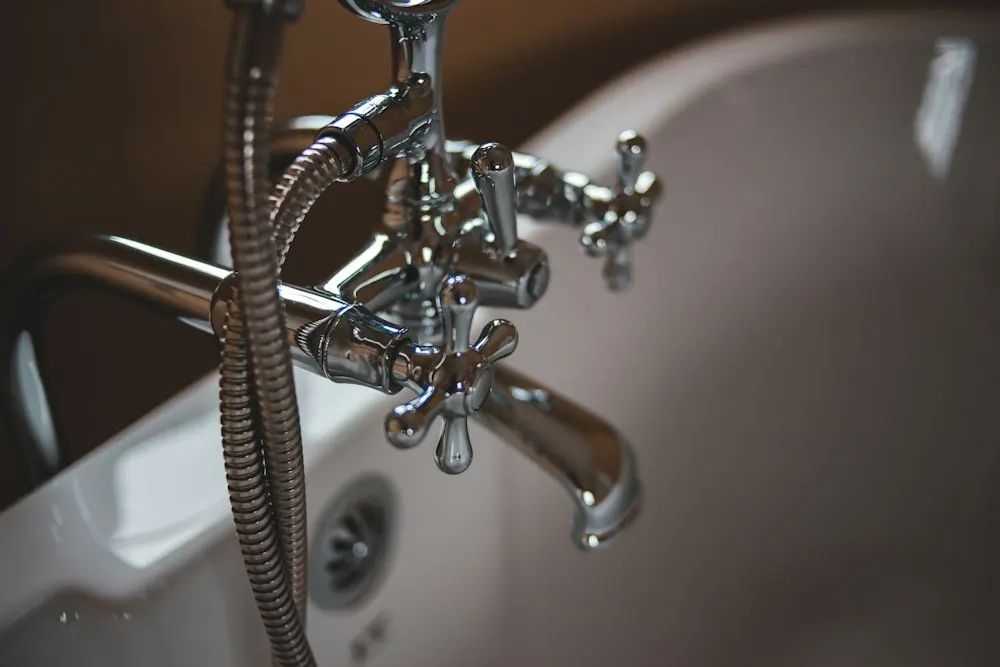 Polished chrome faucet delivering clear water