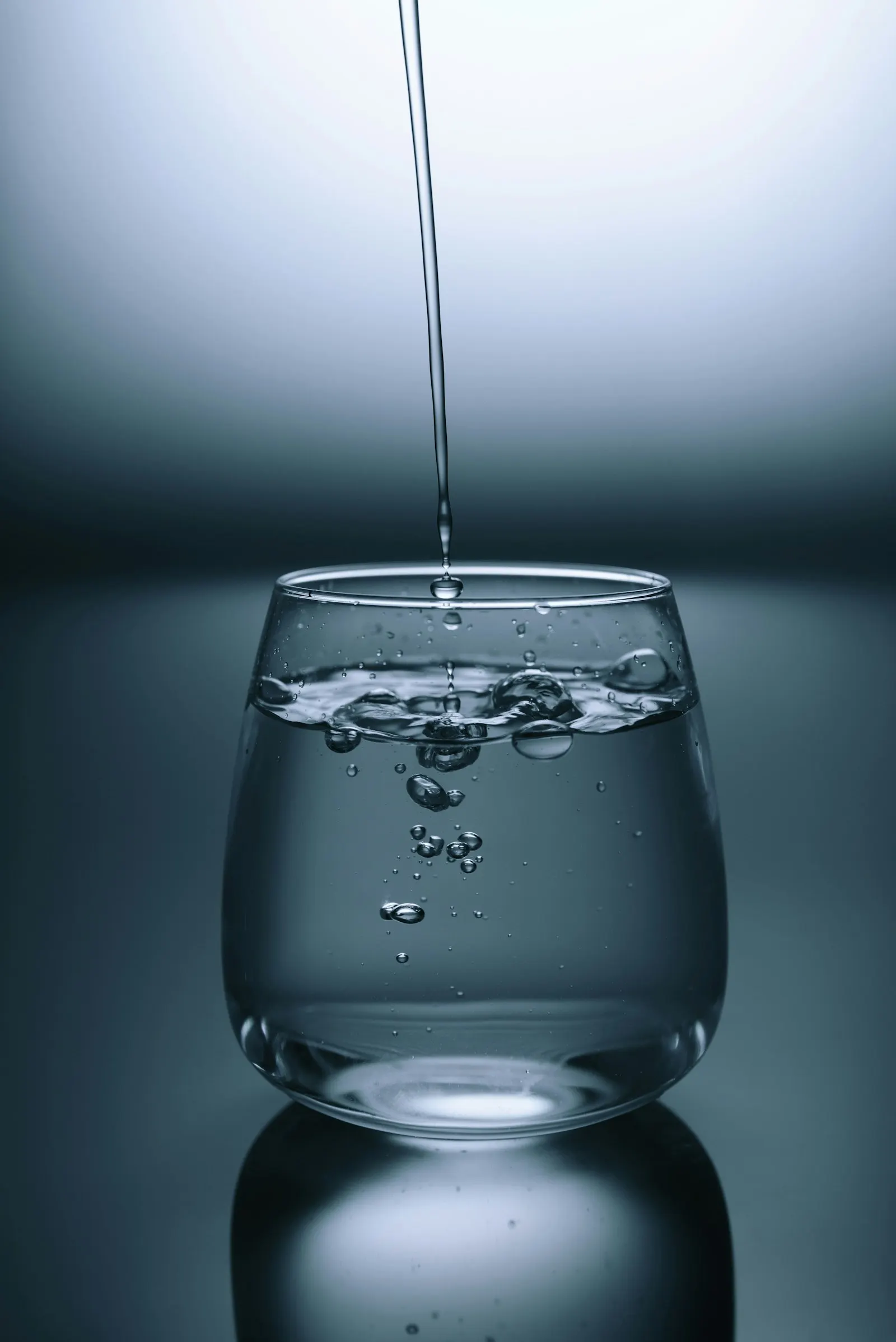 Clean filtered water being poured into a glass